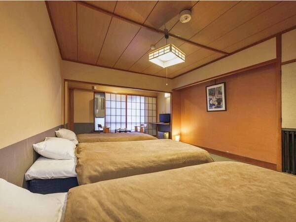 【倶楽部ルームトリプル/例】畳の快適さといつでも横になれるベッドの気楽さを兼ね備えるお部屋