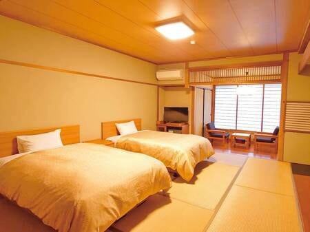低層階ツインベッド和室/例